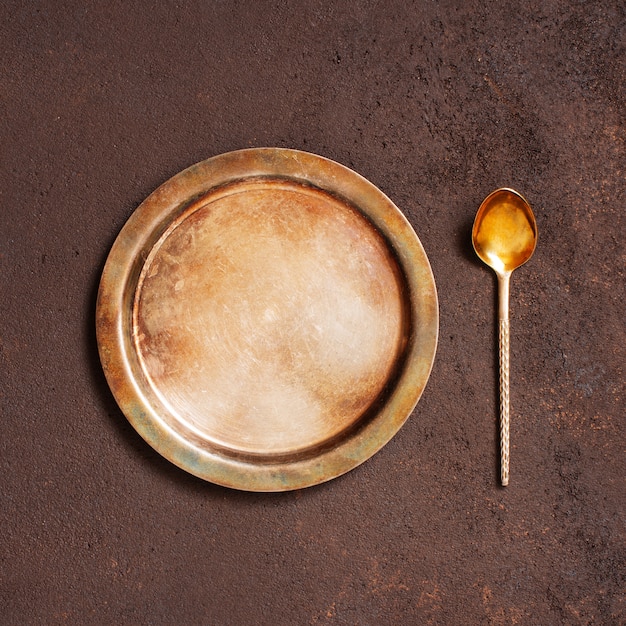 Background with vintage metal plate and spoon