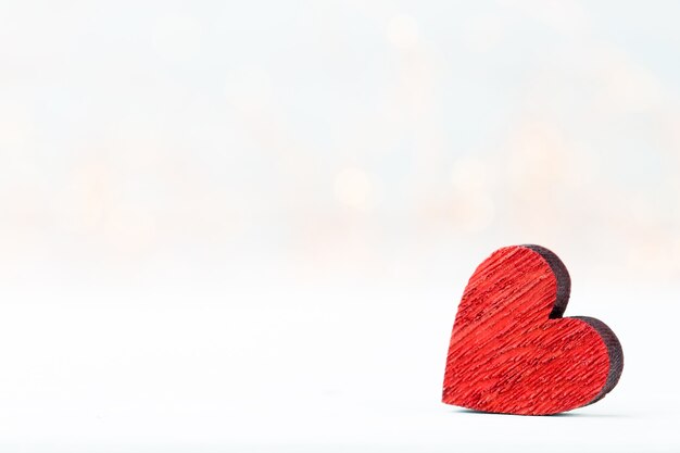 Background with wooden hearts, place for text.