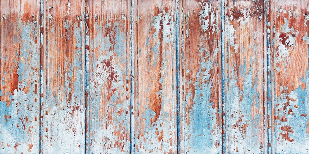 Background wooden board with cracked paint.