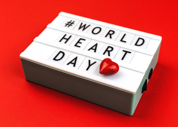 Background for World Heart Day 29th September with red heart concept of love and health care