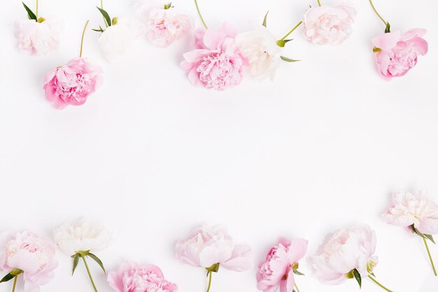 Photo background wreath frame with peonies flat lay top view