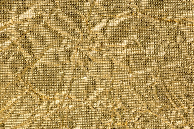Photo background of wrinkled golden paper