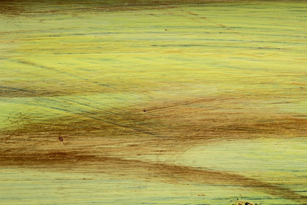 Foto sfondo di una vernice pennellata gialla e marrone.