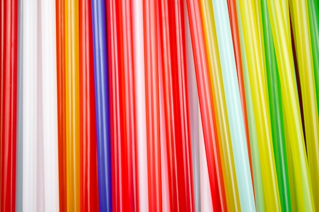 Photo backgroundtexture from multicolored plastic straws for drinks straws for drinks cocktails