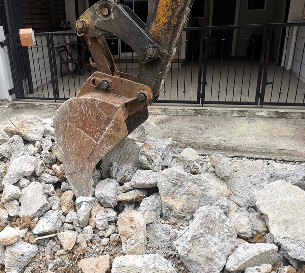 Photo backhoe loader digger at road works construction