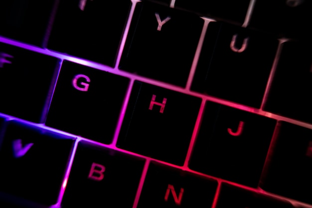 Backlit keyboard detail illuminated in the dark