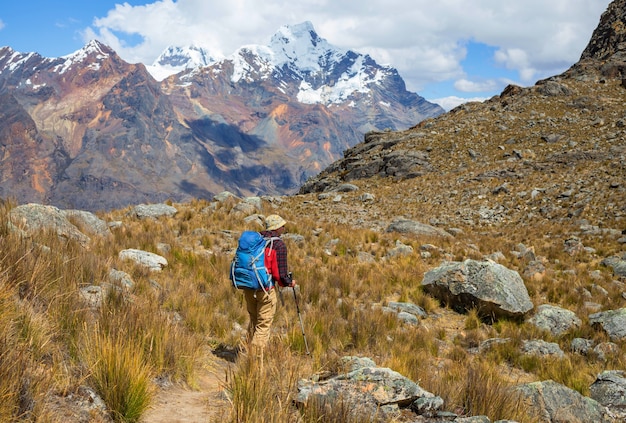 Backpacker in hike in the high mountains