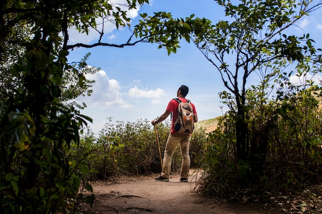 Backpacker watching blue sky