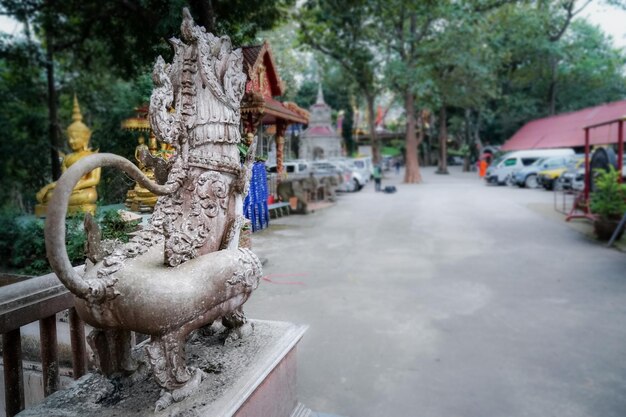 Backside Asia ancient stone lion statue standing on the step to protect the evil asian believing