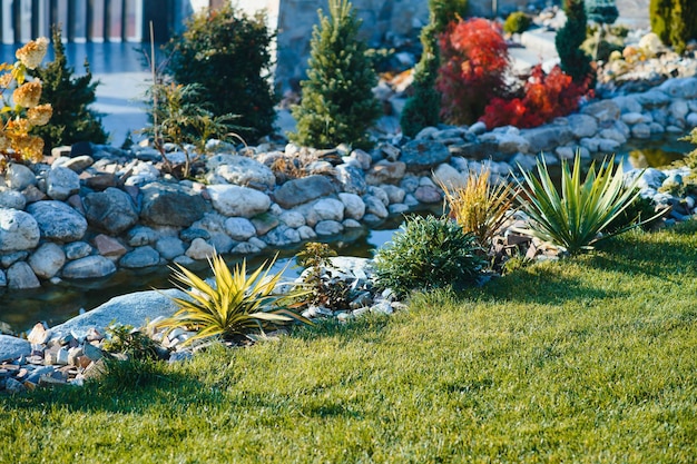 Backyard garden modern design landscaping landscaped back yard
decorative garden with pathway or walkway from stone and rocks or
gravel back yard or park lawn with stony natural landscaping