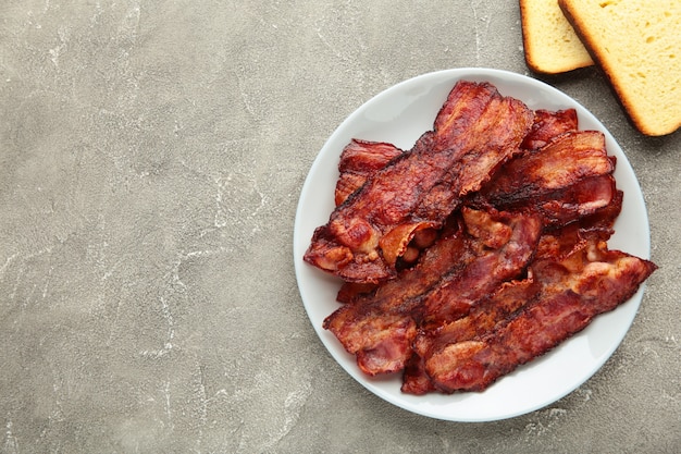 Bacon fried slices in plate 