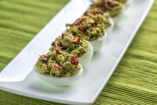 Photo bacon guacamole deviled eggs