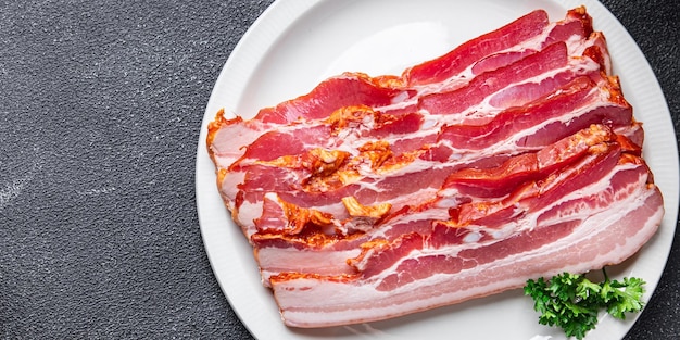 Bacon strips pork slice lard meat meal food snack on the table\
copy space food background top