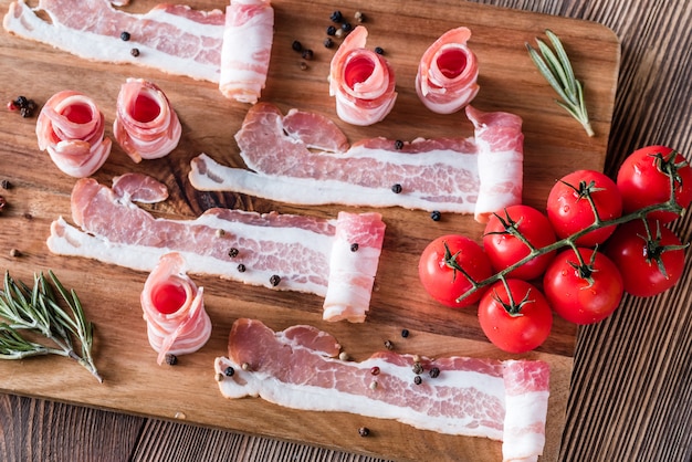 Bacon strips with cherry tomatoes