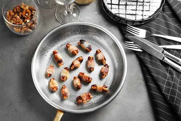 Bacon wrapped dates in frying pan