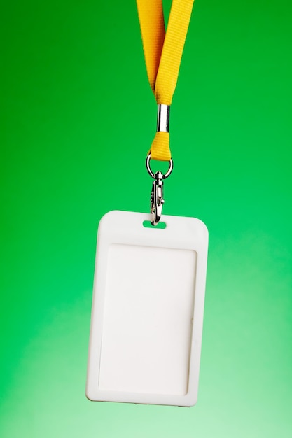 Badge for identification with the name and a yellow cord empty space for text