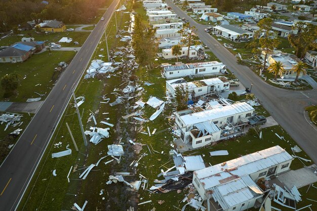 Photo badly damaged mobile homes after hurricane ian in florida residential area consequences of natural disaster