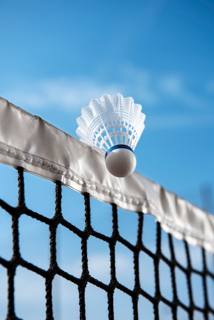 Photo badminton concept with shuttlecock and net