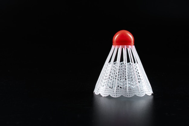 Badminton sport equipment on dark black background close up