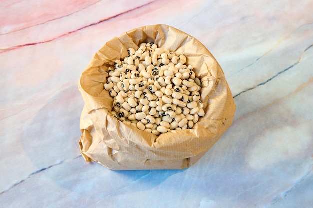 bag full of black beans on a marble table