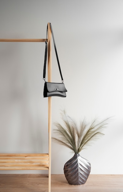 Photo bag hanging from furniture item indoors