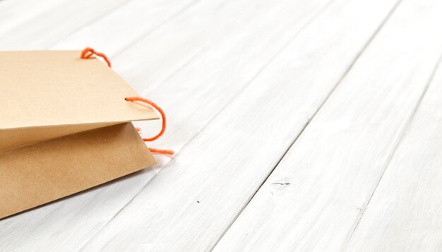 Bag paper brown surprise gift on white wooden