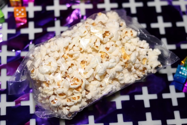 A bag of popcorn on a black and white background