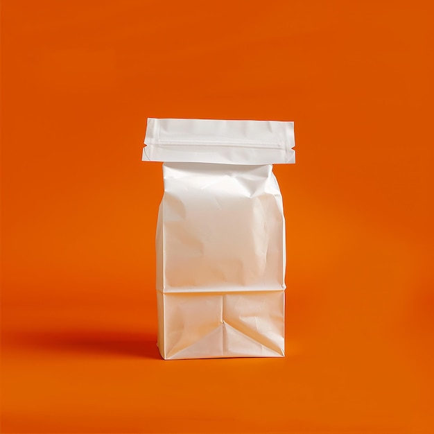 Photo a bag of white flour is on a orange background