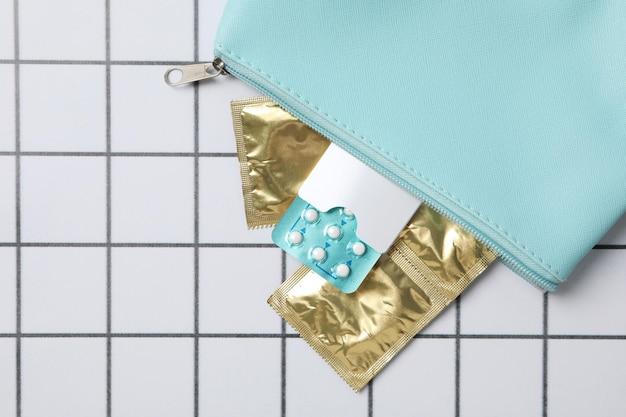 A bag with condoms and birth control pills