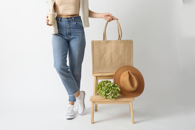 Photo a bag with a hat on a wooden chair