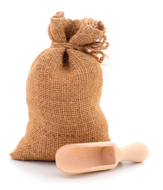 Bag with wheat and wooden spoon