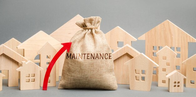 Photo a bag with the word maintenance wooden houses and up arrow rising costs