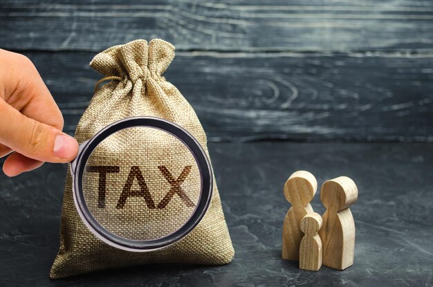 Photo a bag with the word tax and family taxes on real estate payment penalty arrears