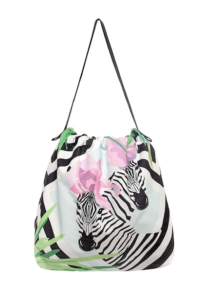 A bag with zebras on it that is printed with pink flowers.