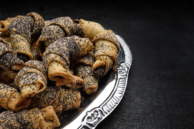 Bagel cookies with jam and poppy seeds with space for text