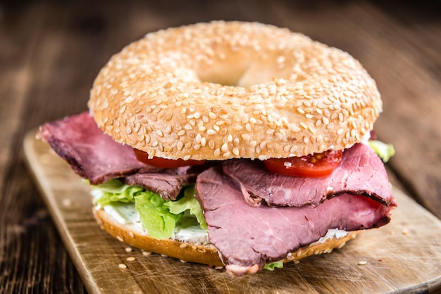 Bagel with Roast Beef on vintage background