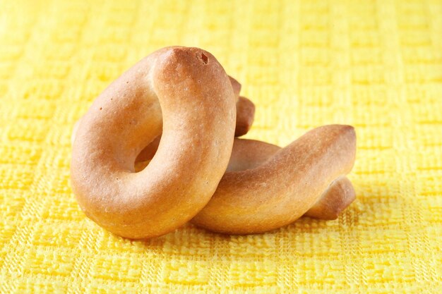 Bagels close up dry bagels on yellow selective soft focus