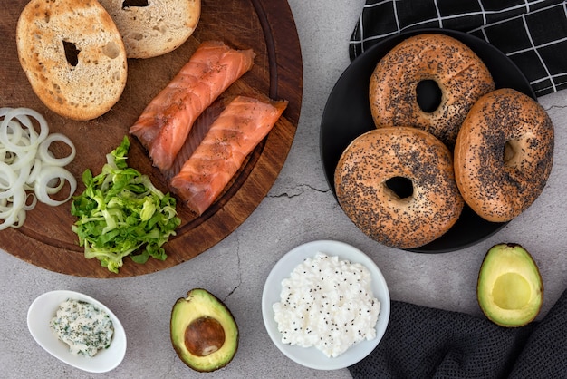 Bagels and ingredients for sandwich on table