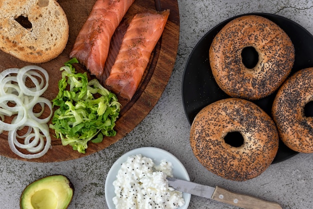 Bagels and ingredients for sandwich on table