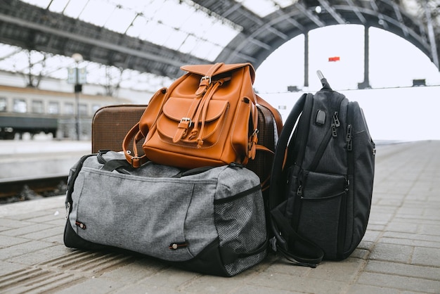 Bags at railway station near railroad