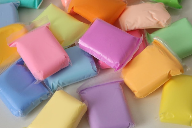 bags with multicolored plasticine are lying