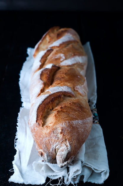 Baguette on black background.