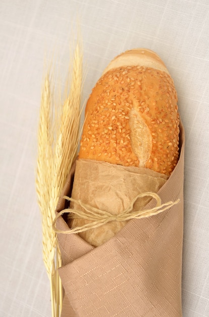 baguette bread wrapped in fabric with wheat