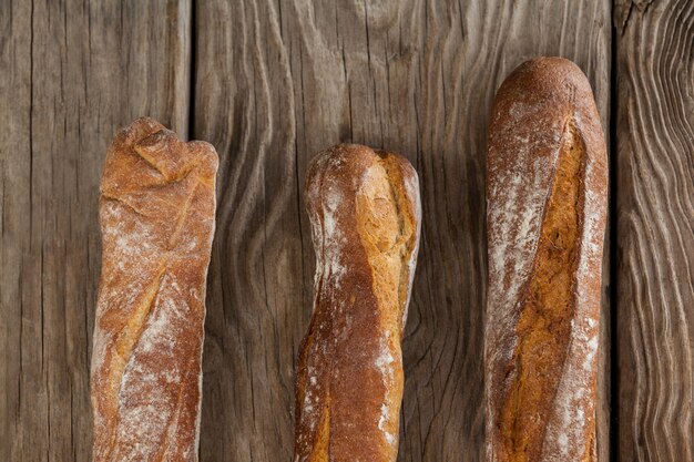 Baguettes on wooden background