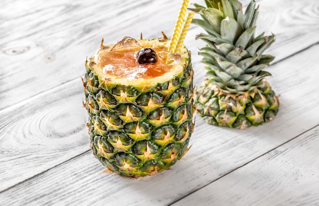 Bahama Mama Cocktail served in hollowed out fresh pineapple