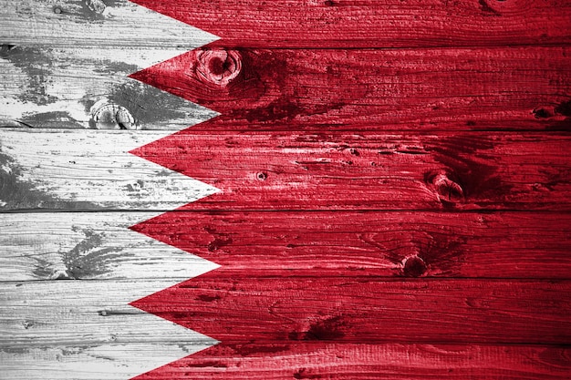 Bahrain flag on wooden planks background wood flag