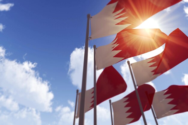 Bahrain flags waving in the wind against a blue sky d rendering