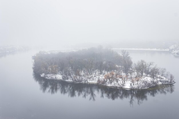 Baida island on the Dnieper river in fog in winter, Zaporozhye, Ukraine.