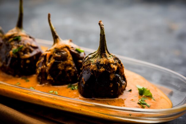 Baingan sabzi or baigan masala or Eggplant or brinjal curry served in bowl or pan, selective focus