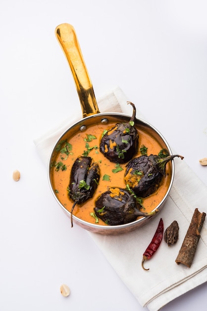 Baingan sabzi or baigan masala or Eggplant or brinjal curry served in bowl or pan, selective focus
